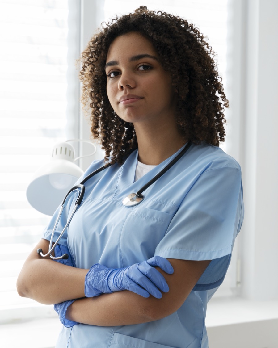 Nurse in blue scrubs with a stethoscope