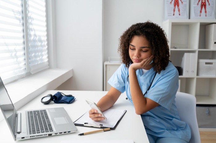 Clinician reviewing patient notes